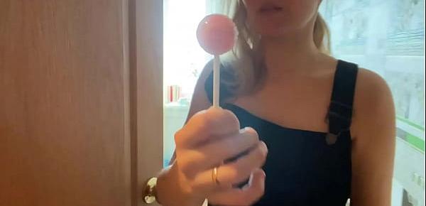  Charming Lady in Sexy Lingerie Licking Lollipop